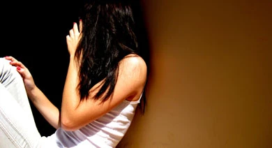 girl hiding face