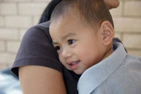 toddler holding mother